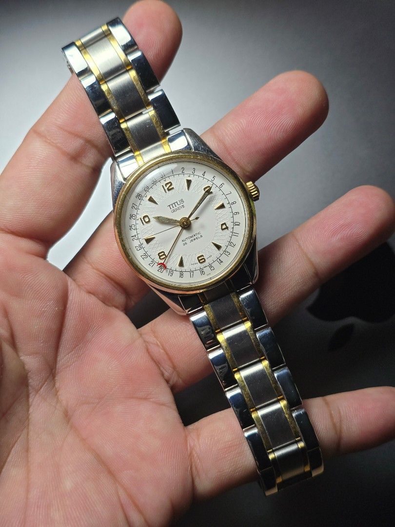 Titus pointer date (Category: Men's Watches) located in Manila. Submitted by strapsnskins (Listing ID 1467354581, Image 2). Description: • Brand: Titus Genève (Solvil et Titus) • Complication: Pointer Date — instead of a traditional date window, a central crescent-tipped hand points to the dates (1 to 31) printed along the outermost track of the dial. • Movement: Automatic self-winding mechanism containing 25 Jewels (frequently utilizing a reliab