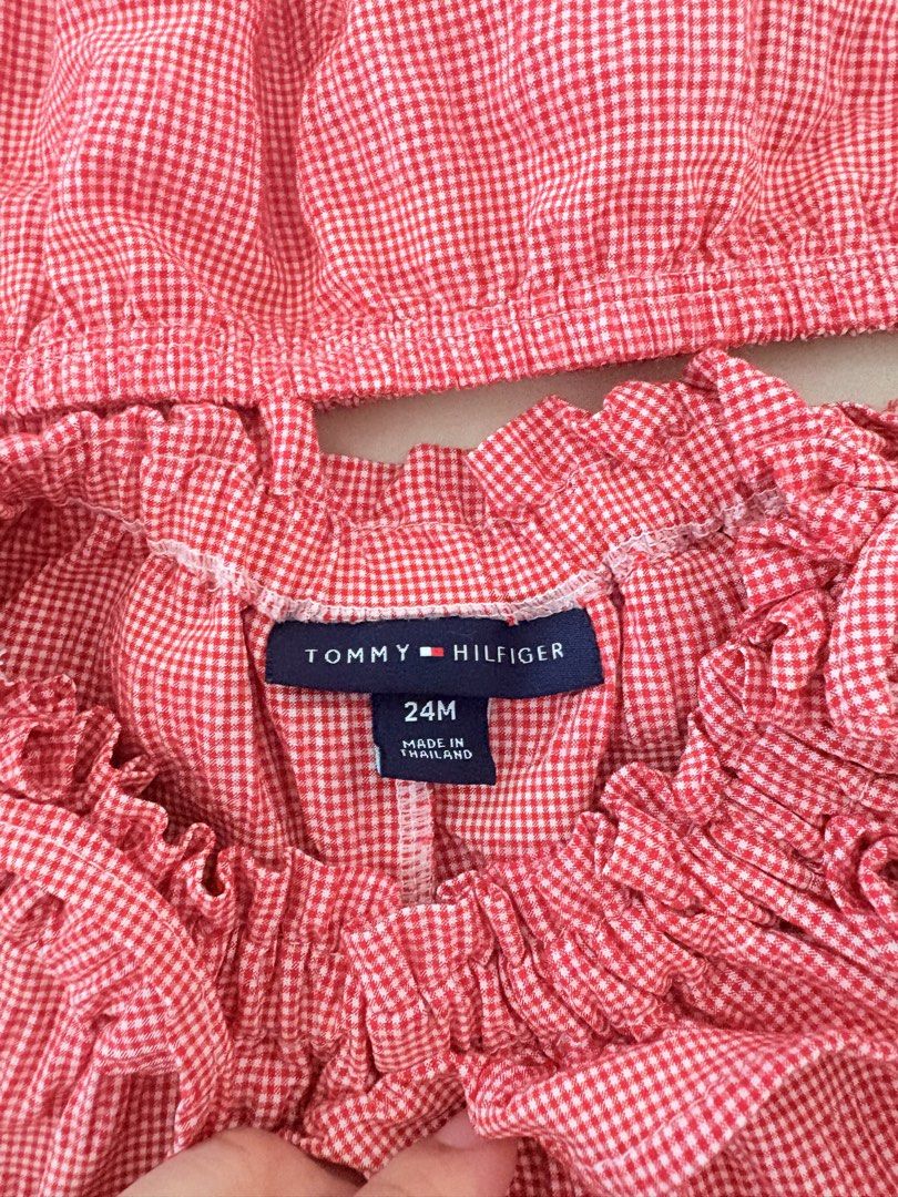 Tommy Hilfiger Red Gingham Top and Skort Set 24M (Category: Babies & Kids Fashion) located in Tarlac. Submitted by therusticaddict (Listing ID 1467191078, Image 2). Description: - Brand: Tommy Hilfiger - Style: Red and white gingham two-piece set (crop top & skort) - Size: 24M (Made in Thailand) - Details: Smocked neckline, embroidered flag logo, elastic waistband, and ruffled trim - Material: Lightweight and comfortable fabric for toddlers -GOOD