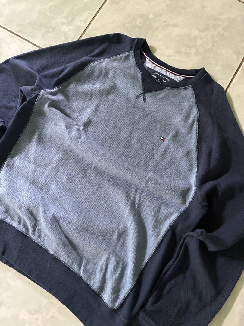 Tommy Hilfiger Two-Tone Raglan Sweatshirt (Category: Coats, Jackets and Outerwear) located in Batangas. Submitted by jinventoryarchive (Listing ID 1467230420, Image 2). Description: 21x27 - Brand: Tommy Hilfiger - Style: Crewneck sweatshirt with raglan sleeves - Color: Navy blue and light blue contrast - Size: Medium - Details: Thermal waffle knit chest/back panels, embroidered flag logo on chest, contrast ribbed cuffs, collar, and hem - Material
