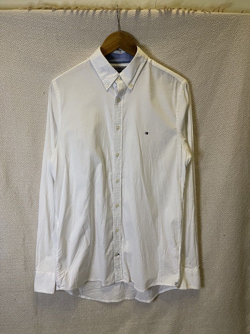Tommy hilfiger white polo button down long sleeve (Category: Tshirts & Polo Shirts ) located in Manila. Submitted by hypestock_mnl (Listing ID 1467218346, Image 1). Description: - stylish - perfect for casual wear - great fit - in good condition - minimal signs of usage - 9/10 - money worth! - see pics for details/issue.