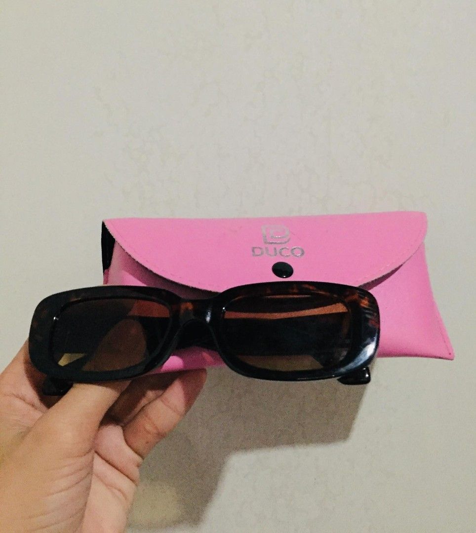 Tortoiseshell Rectangular Sunglasses with Pink Case (Category: Sunglasses & Eyewear) located in Batangas. Submitted by fabufindsstore. (Listing ID 1467272822, Image 1). Description: Tortoiseshell Rectangular Sunglass Free bright pink leatherette pouch with snap closure Best for: Daily wear, driving, and sunny outdoor trips 220 only Mode of Payment (Gcash Payment first) Delivery Thru J&T (SF shoulder by buyer) .