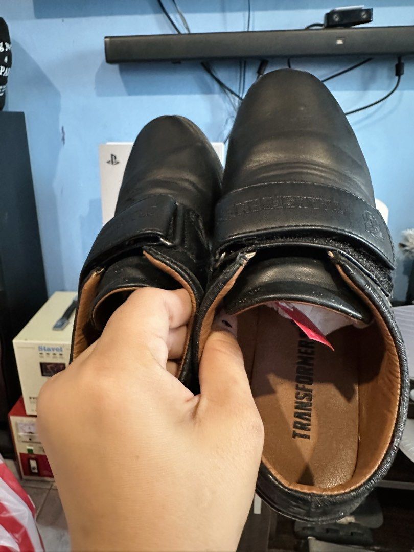 Transformers Black School Shoes Size 37 (Category: Babies & Kids Fashion) located in Manila. Submitted by htaviles (Listing ID 1467347328, Image 2). Description: Transformers black leather school shoes in size 37. Features Velcro strap closure with embossed Autobot logo and Transformers branding on the strap and insole. Brown interior lining. Includes original Transformers shoe box with matching product stickers..