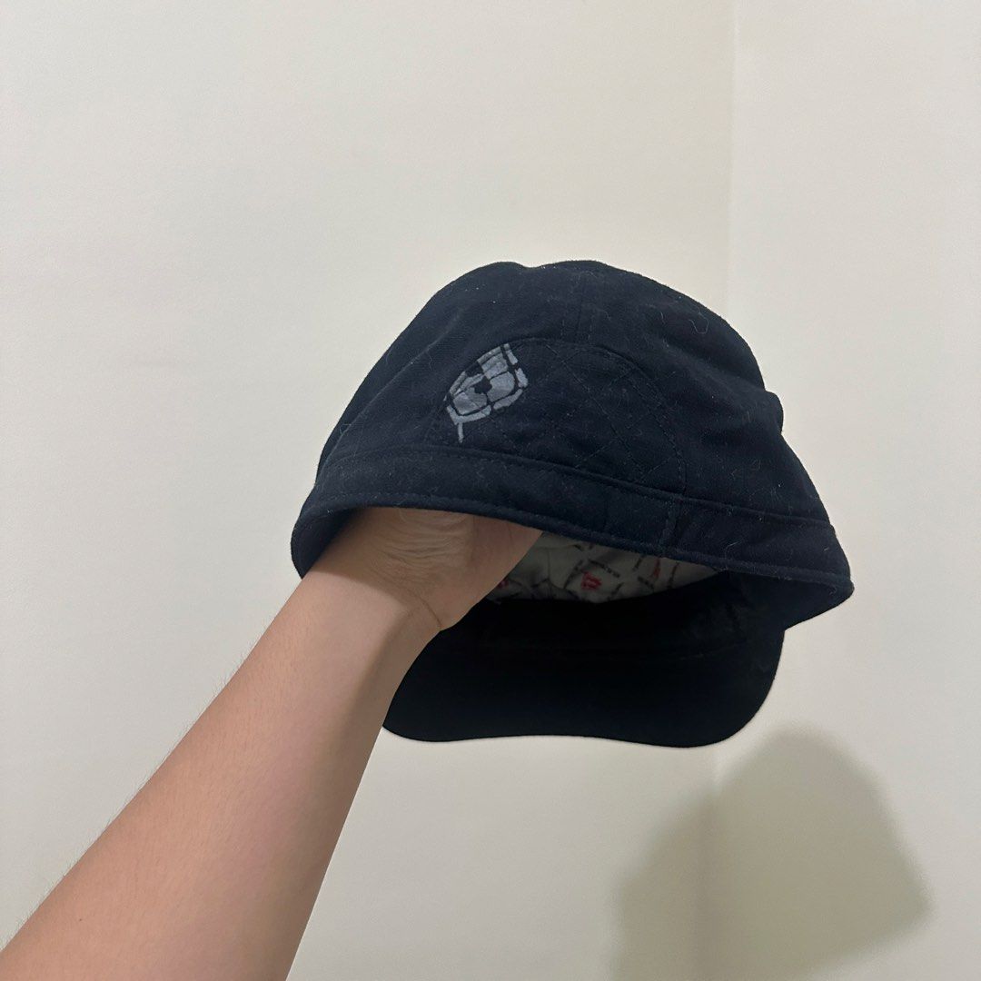 Transnine Black Cotton Cadet Cap Size M (Category: Caps & Hats) located in Bulacan. Submitted by enne_123 (Listing ID 1467299125, Image 2). Description: - Brand/Model: Transnine black cadet hat - Size: M - Material: 100% cotton, made in Taiwan - Design details: Embroidered side branding, custom printed inner lining, and quilted back panel - Condition: Some lint visible on the fabric surface due to normal storage and handling.
