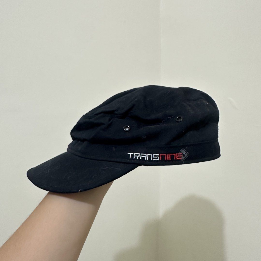 Transnine Black Cotton Cadet Cap Size M (Category: Caps & Hats) located in Bulacan. Submitted by enne_123 (Listing ID 1467299125, Image 1). Description: - Brand/Model: Transnine black cadet hat - Size: M - Material: 100% cotton, made in Taiwan - Design details: Embroidered side branding, custom printed inner lining, and quilted back panel - Condition: Some lint visible on the fabric surface due to normal storage and handling.