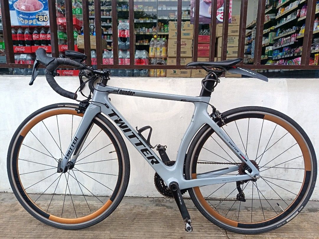 Twitter Thunder Road Bike Grey (Category: Bicycles) located in Manila. Submitted by johnluis.16 (Listing ID 1467285983, Image 2). Description: FOR SALE: TWITTER THUNDER AERO ROADBIKE SZ 48 ✅ SHIMANO 105 R7000 GROUPSET 2X11 SPEED ✅ SHIMANO 105 RIM BREAKS F&B ✅ SHIMANO 105 STI LEVERS ✅ SHIMANO 105 CRANK SET WITH MTB CLEATS ✅ CARBON TWITTER THUNDER FRAME ✅ CARBON ZIPP DROPBAR ✅ 3T ARX STEM ✅ RETROSPEC HUBS ✅ XOSS G+ Computer ✅ MAXXIS DETONATOR TIRES