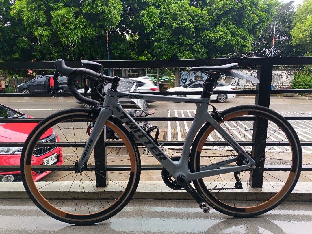 Twitter Thunder Road Bike Grey (Category: Bicycles) located in Manila. Submitted by johnluis.16 (Listing ID 1467285983, Image 1). Description: FOR SALE: TWITTER THUNDER AERO ROADBIKE SZ 48 ✅ SHIMANO 105 R7000 GROUPSET 2X11 SPEED ✅ SHIMANO 105 RIM BREAKS F&B ✅ SHIMANO 105 STI LEVERS ✅ SHIMANO 105 CRANK SET WITH MTB CLEATS ✅ CARBON TWITTER THUNDER FRAME ✅ CARBON ZIPP DROPBAR ✅ 3T ARX STEM ✅ RETROSPEC HUBS ✅ XOSS G+ Computer ✅ MAXXIS DETONATOR TIRES