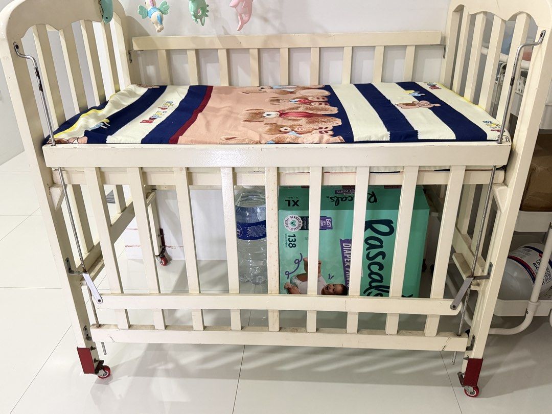 Two level wooden Foldable crib (Category: Cots & Cribs) located in Las Pinas. Submitted by carou56713 (Listing ID 1467291267, Image 2). Description: Customized wooden foldable crib @8k With foam Used only for one year Freebies: 2pcs foam cover .