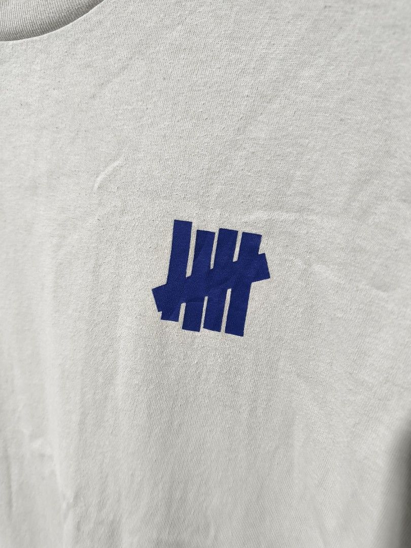 UNDEFEATED (Category: Tshirts & Polo Shirts ) located in Pandi. Submitted by rhaine.2zz (Listing ID 1467255005, Image 3). Description: UNDEFEATED EXCELLENT CONDITION ISSUE MINIMAL LINTS ONLY NO PINHOLE NO CRACK PRINT OFF WHITE COLOR WAY 23/28 MEDIUM ON TAG NEED WASH 📩📩📩.