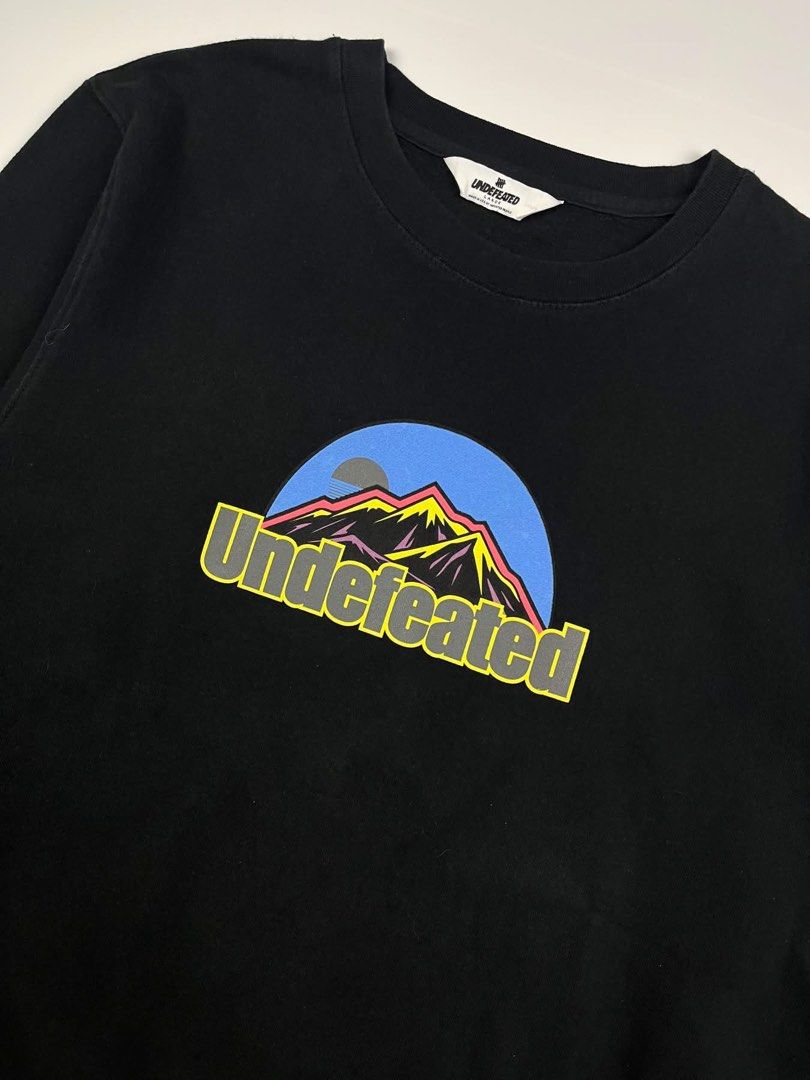 Undefeated - Mountain Graphic Crewneck (Category: Tshirts & Polo Shirts ) located in Puerto Princesa. Submitted by rrugsgallery (Listing ID 1467335677, Image 3). Description: Undefeated - Mountain Graphic Crewneck Tagged Size: Large Length: 29.5 Width: 23.5 Condition: Excellent Color rate: 10 Flaws: None.