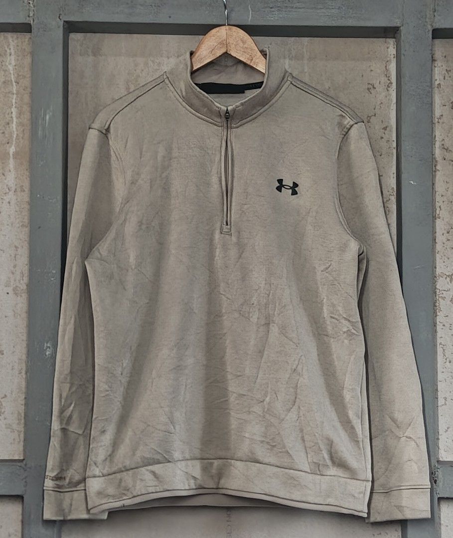 Under Armour Golf ColdGear 1/2 Zip Pullover (Category: Coats, Jackets and Outerwear) located in Muntinlupa City. Submitted by thriftben (Listing ID 1467238390, Image 1). Description: - Brand: Under Armour Golf - Style: ColdGear 1/4 zip pullover - Color: Beige heather - Size: Medium (Loose fit) - Details: Black UA logo on chest and back collar - Origin: Made in Jordan - Condition: Perfect comfortable layering piece for cooler weather or daily wear