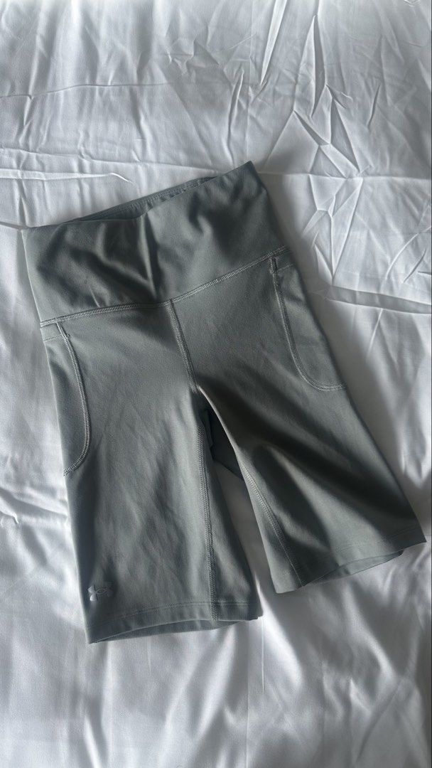 Under Armour Grey Biker Shorts with Pockets (Category: Activewear) located in Muntinlupa City. Submitted by vjellimac (Listing ID 1467188998, Image 1). Description: - Brand: Under Armour - Color: Grey - Style: Compression biker shorts - Waistband: High-rise for extra support - Pockets: Convenient side pockets on both legs - Details: Small Under Armour logo stamped near the bottom left hem - Ideal for: Workouts, gym sessions, or daily casual wear.