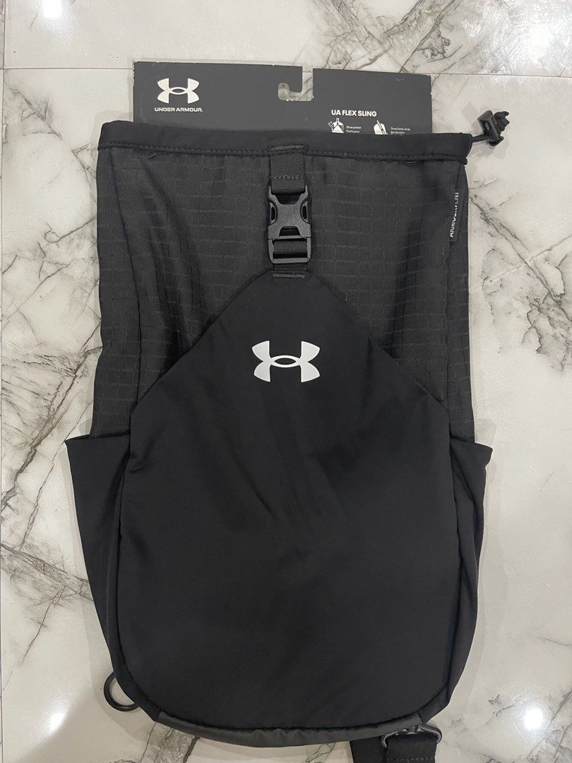 Under Armour UA Flex Sling Bag Black (Category: Sling Bags) located in San Jose del Monte. Submitted by xdy12 (Listing ID 1467217646, Image 1). Description: - Brand new with original tags attached - Color: Classic Black - Capacity: 10 Liters - ArmourVent technology for breathability - Versatile shoe pocket (fits shoes or a jacket) - Dual water bottle pockets for easy hydration - Cross-body strap with bold Under Armour lettering - Original retail 