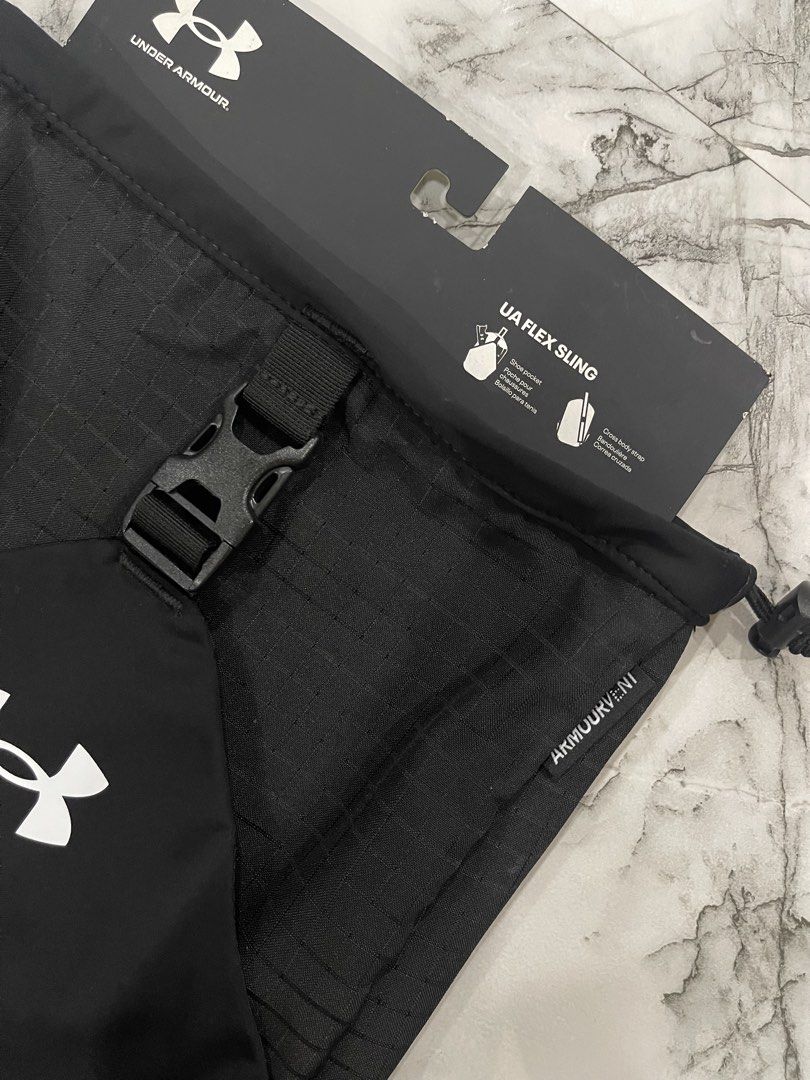 Under Armour UA Flex Sling Bag Black (Category: Sling Bags) located in San Jose del Monte. Submitted by xdy12 (Listing ID 1467217646, Image 2). Description: - Brand new with original tags attached - Color: Classic Black - Capacity: 10 Liters - ArmourVent technology for breathability - Versatile shoe pocket (fits shoes or a jacket) - Dual water bottle pockets for easy hydration - Cross-body strap with bold Under Armour lettering - Original retail 