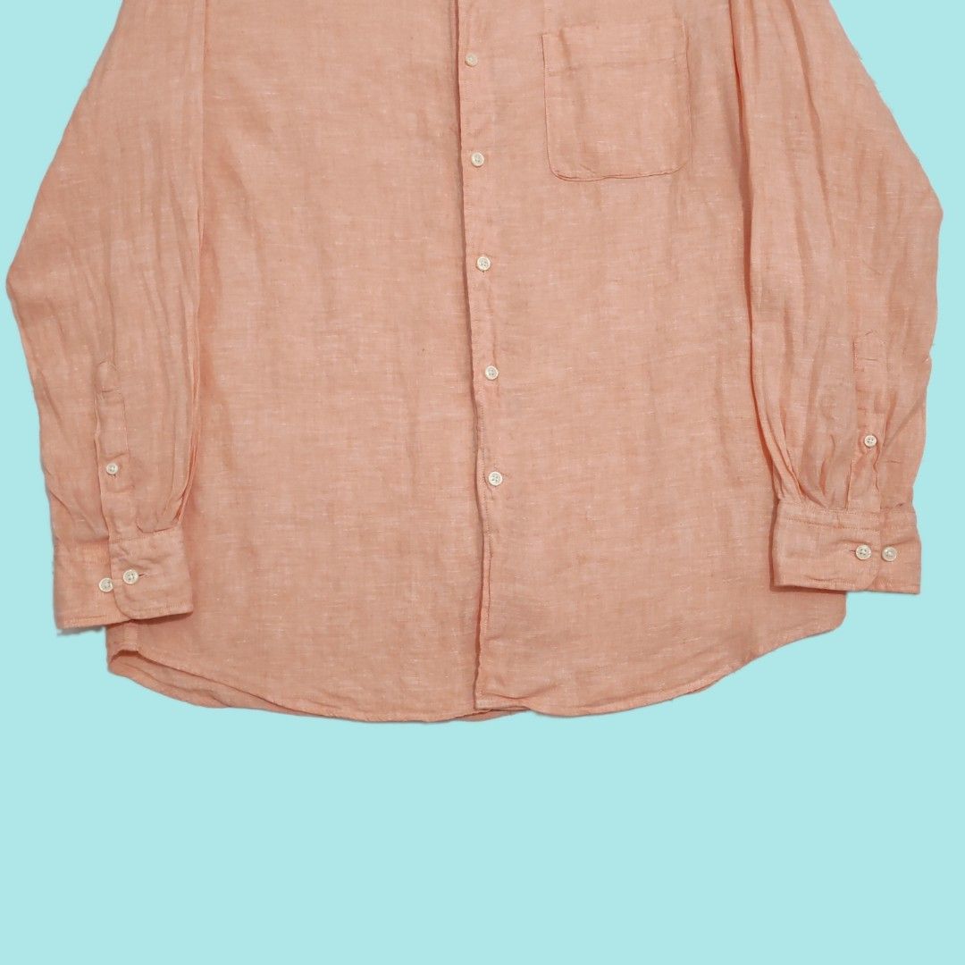 Uniqlo 100% Linen button up shirts (Category: Tshirts & Polo Shirts ) located in Tarlac. Submitted by senkustuff (Listing ID 1467312968, Image 3). Description: - Brand: Uniqlo - Color: Peach - Material: 100% Linen (lightweight & breathable) - Size: XL (Chest: 104-112cm, Height: 180/108B) - Features: Standard collar, single chest pocket, buttoned cuffs - Condition: Clean, like-new with spare buttons attached on inner tag - Origin: Made in China Di