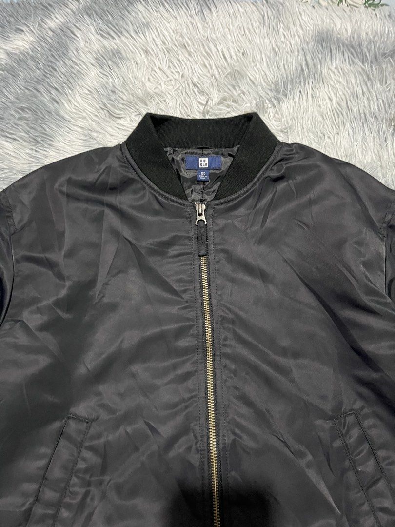 Uniqlo Bomber Jacket (Category: Babies & Kids Fashion) located in Sasmuan (Sexmoan). Submitted by winterclothes.ph (Listing ID 1467329908, Image 2). Description: Uniqlo Bomber Jacket 150 on tag Width 20 Length 22 Excellent Condition .