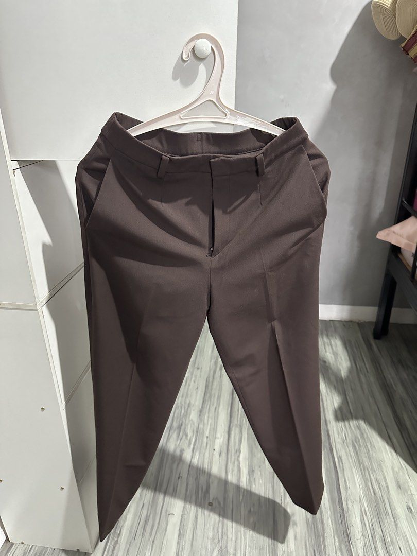 Uniqlo Brown Trousers Size S (Category: Other Bottoms) located in Valenzuela. Submitted by crzrvll26 (Listing ID 1467202825, Image 1). Description: - Brand: Uniqlo - Item: Dark Brown Trousers - Size: S (Waist: 60-66cm, Hips: 85-91cm) - Material: Comfortable polyester, rayon, and spandex blend - Versatile dark brown shade, easy to style for work or casual days - Features: Standard zip fly, belt loops, and functional back welt pockets - Condition: 