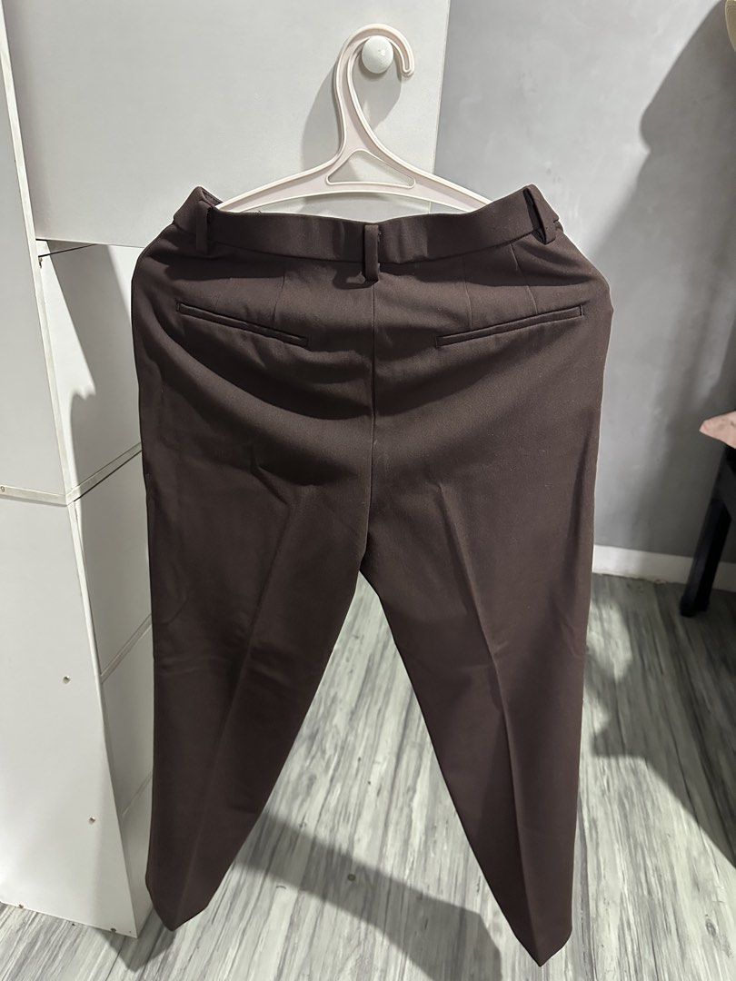 Uniqlo Brown Trousers Size S (Category: Other Bottoms) located in Valenzuela. Submitted by crzrvll26 (Listing ID 1467202825, Image 2). Description: - Brand: Uniqlo - Item: Dark Brown Trousers - Size: S (Waist: 60-66cm, Hips: 85-91cm) - Material: Comfortable polyester, rayon, and spandex blend - Versatile dark brown shade, easy to style for work or casual days - Features: Standard zip fly, belt loops, and functional back welt pockets - Condition: 