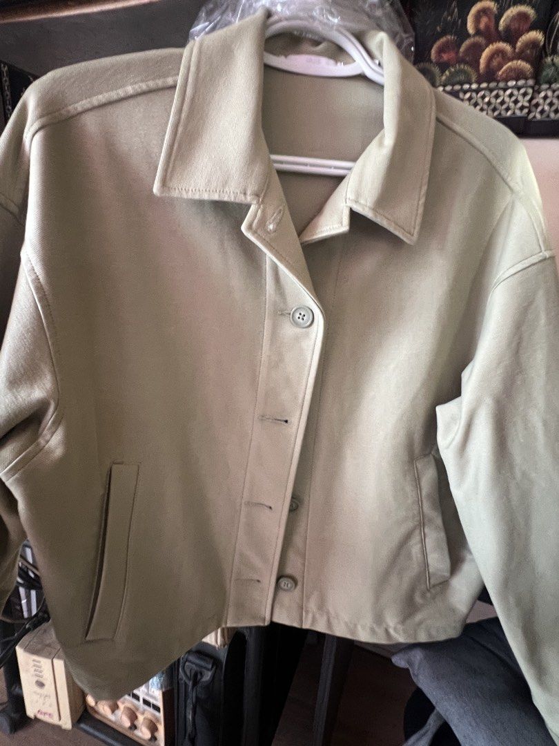 Uniqlo Jersey Relaxed Jacket Green - M (Category: Coats, Jackets and Outerwear) located in Dasmarinas. Submitted by stuffsbyklay (Listing ID 1467254747, Image 3). Description: - Brand: Uniqlo - Item: Jersey Relax Jacket - Color: Green - Size: M (Bust 80-86cm) - Condition: Brand new with original tag (2,990 yen) and 2 extra buttons - Material: Soft, textured fabric - Design: Button-up front, fold-down collar, long sleeves, and two front slit pocke