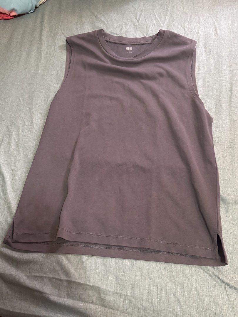Uniqlo Sleeveless Men’s top (Category: Tshirts & Polo Shirts ) located in Imus. Submitted by jaimeenrico8 (Listing ID 1467203789, Image 1). Description: - Brand/Model: Uniqlo sleeveless top - Color: Purple - Size: Large - Material: Lightweight, breathable cotton - Design: Classic crew neckline with ribbed trim, tagless printed label - Fit: Straight hemline with side slits for comfortable movement - Condition/Use: Great staple piece for casual dai