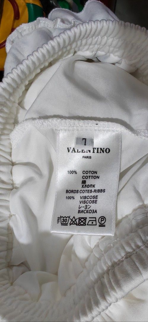 Valentino Paris White Ruffled Skort (Category: Skirts) located in Mandaluyong City. Submitted by trisha_001 (Listing ID 1467274201, Image 2). Description: - Brand: Valentino Paris - Color: White - Size: Tag says size 7 - Material: 100% cotton with viscose ribbed details - Design: Multiple tiered ruffles cascading down the front - Waist: Elastic waistband with adjustable drawstring closure - Condition: Clean and ready to wear - 28 to 32 inches wai