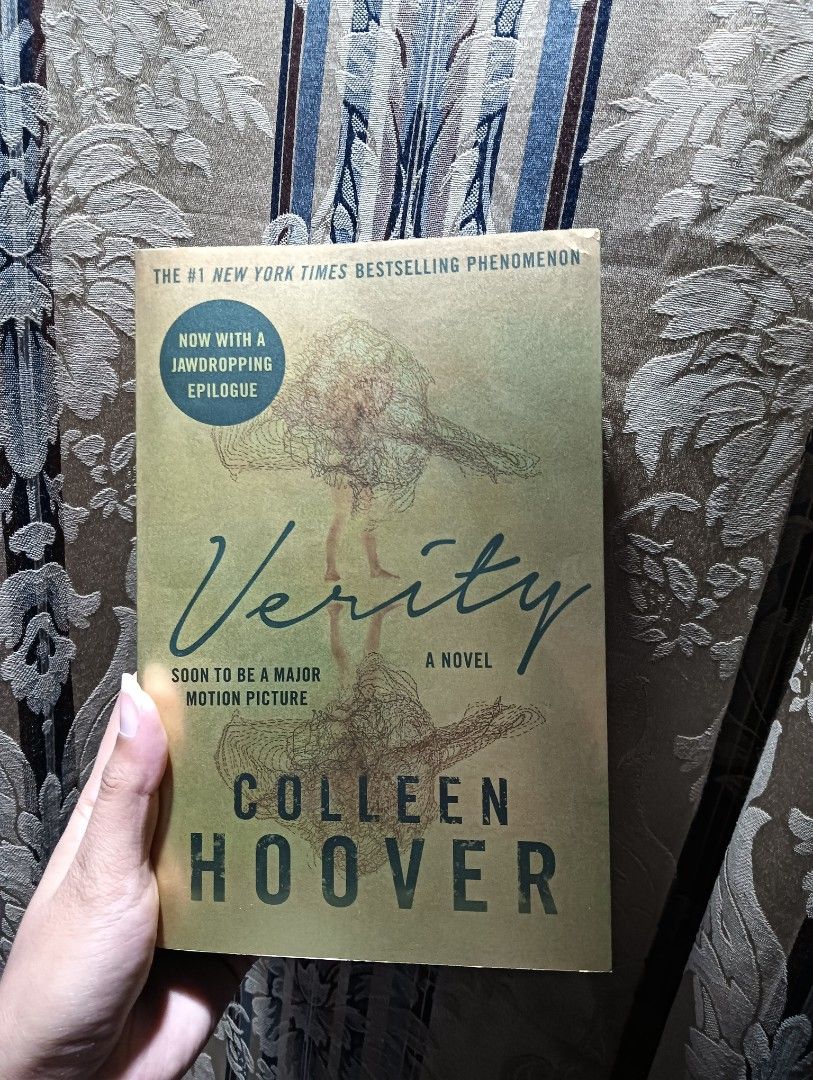 Verity by Colleen Hoover (Category: Storybooks) located in Rosales. Submitted by princessalfruto (Listing ID 1467251412, Image 1). Description: - Title: Verity by Colleen Hoover - Edition: Paperback with special edition gold cover design - Special Features: Includes the jaw-dropping epilogue and major motion picture callouts -With sprayed edges.
