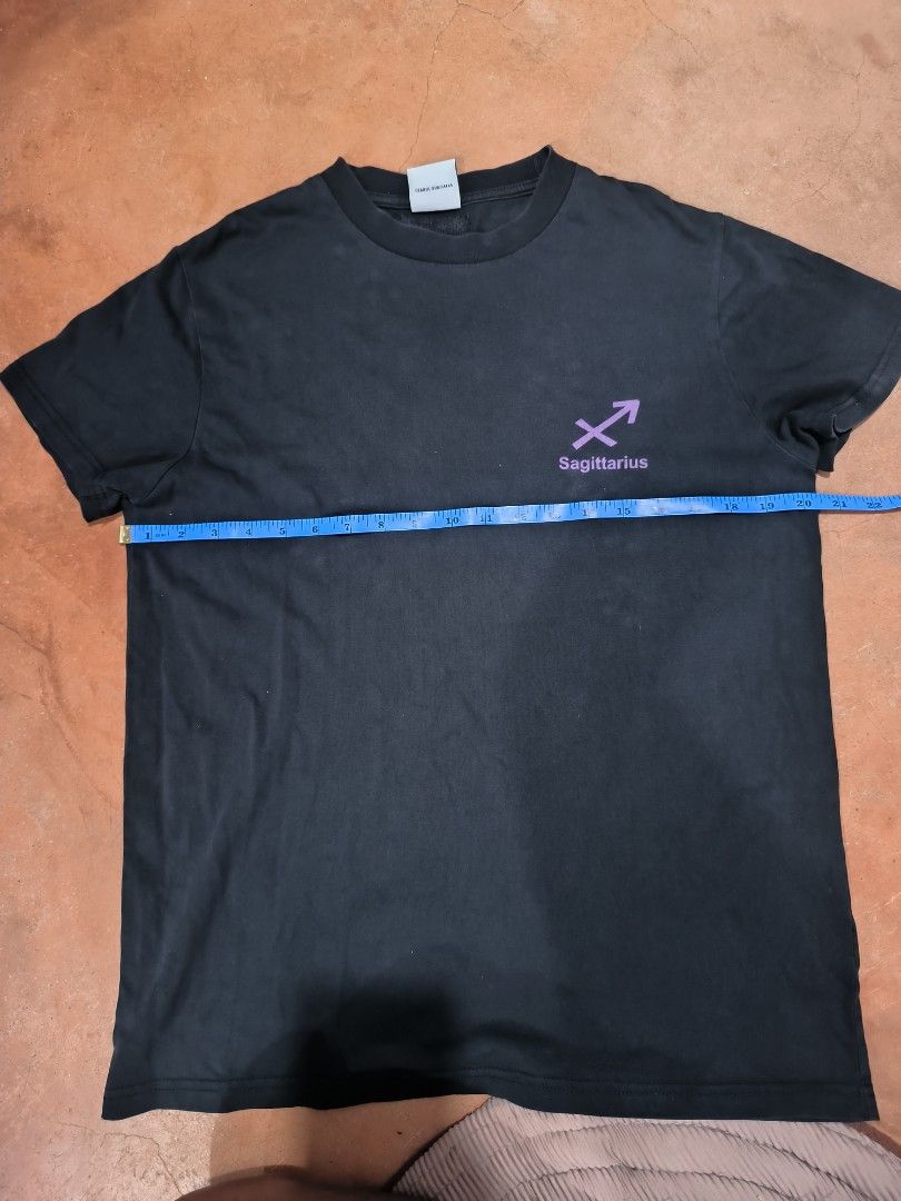 Vetements Sagittarius Tee (Category: Tshirts & Polo Shirts ) located in San Jose del Monte. Submitted by thriftydiariesph (Listing ID 1467326550, Image 1). Description: 🖤 Vetement Sagittarius Graphic Tee ♐️💜 Minimalist design with a purple Sagittarius zodiac print. Classic round neck, short sleeves, and an easy-to-style look. Perfect for everyday wear and zodiac lovers! 📏 Pit-to-pit: Approximately 22 inches 🎨 Color: Black with purple print 👕
