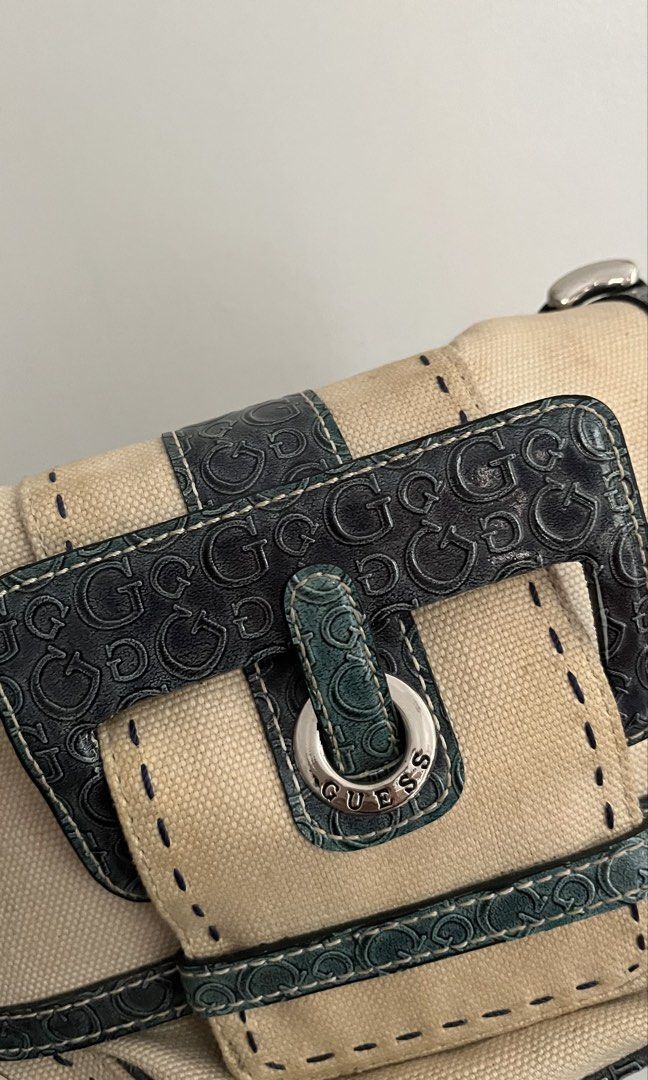 Vintage Guess bag (Category: Shoulder Bags) located in Manila. Submitted by iayo.15 (Listing ID 1467264312, Image 2). Description: Authentic guess, i got it in Dubai! I super love this bag, but i haven’t used it in a hot minute so there’s some yellow discoloration, I’m not sure if it can be washed. i’m open for negotiation :>> RFS: im moving out of the country ( pls buy me ).