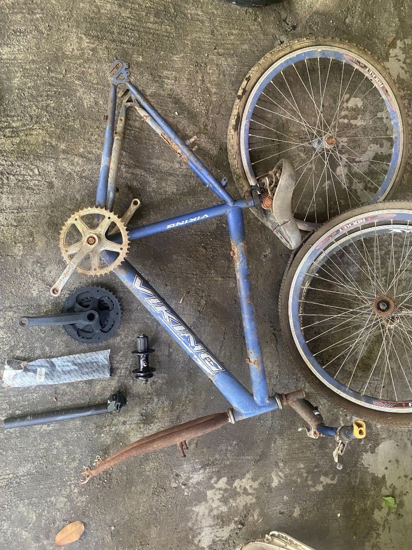 Viking bicycle frame and parts project (Category: Bicycles) located in Calamba. Submitted by jemmssszzz1 (Listing ID 1467284959, Image 1). Description: - Viking bicycle frame with blue finish - Includes two wheels with Rocket tires, front fork, handlebars, seat, spare cranksets, hub, and seatpost - Features rusted areas on the frame and components - Ideal restoration project or parts donor - Pick up only.