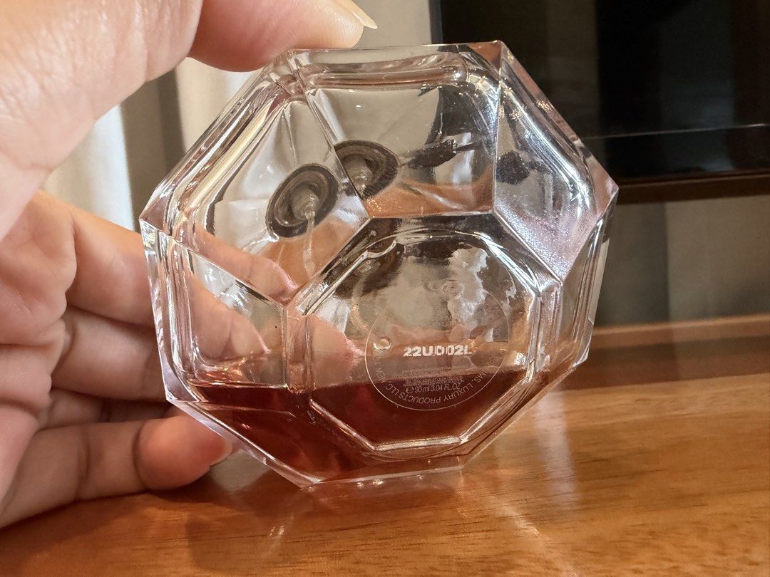 Viktor & Rolf Flowerbomb Nectar EDP 90ml (Category: Fragrance & Deodorants) located in San Antonio. Submitted by luvstuffffff (Listing ID 1467180102, Image 3). Description: Viktor and Rolf Flowerbomb Nectar Eau de Parfum. 90ml bottle size. Around a quarter of the fragrance remains inside. Batch code 22UD02L printed on the bottom. Heavy glass grenade-shaped bottle with metal seal tag attached to the neck. Spray nozzle works fine. Authentic bottle 