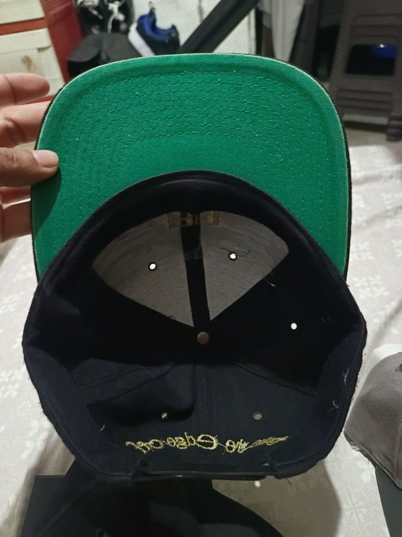 Vintage Benson & Hedges Special Kings Black Snapback Cap (Category: Caps & Hats) located in Jaen. Submitted by ratbunizer (Listing ID 1467273612, Image 2). Description: - Color: Black with contrasting green undervisor - Embroidery: Gold Benson & Hedges Special Kings logo on front and "take the edge off" text on back - Fit: Adjustable plastic snap closure for a custom fit - Style: Classic snapback design, great forstreetwear issue rust under top b