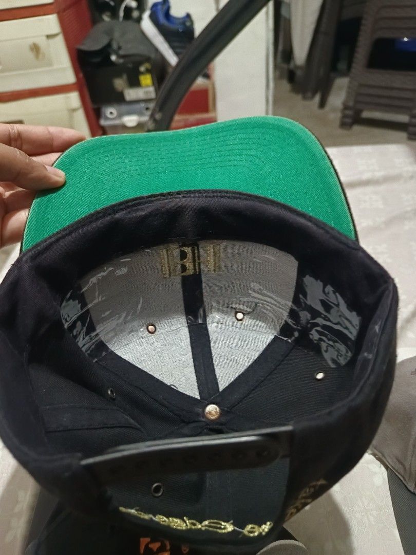 Vintage Benson & Hedges Special Kings Black Snapback Cap (Category: Caps & Hats) located in Jaen. Submitted by ratbunizer (Listing ID 1467273612, Image 3). Description: - Color: Black with contrasting green undervisor - Embroidery: Gold Benson & Hedges Special Kings logo on front and "take the edge off" text on back - Fit: Adjustable plastic snap closure for a custom fit - Style: Classic snapback design, great forstreetwear issue rust under top b