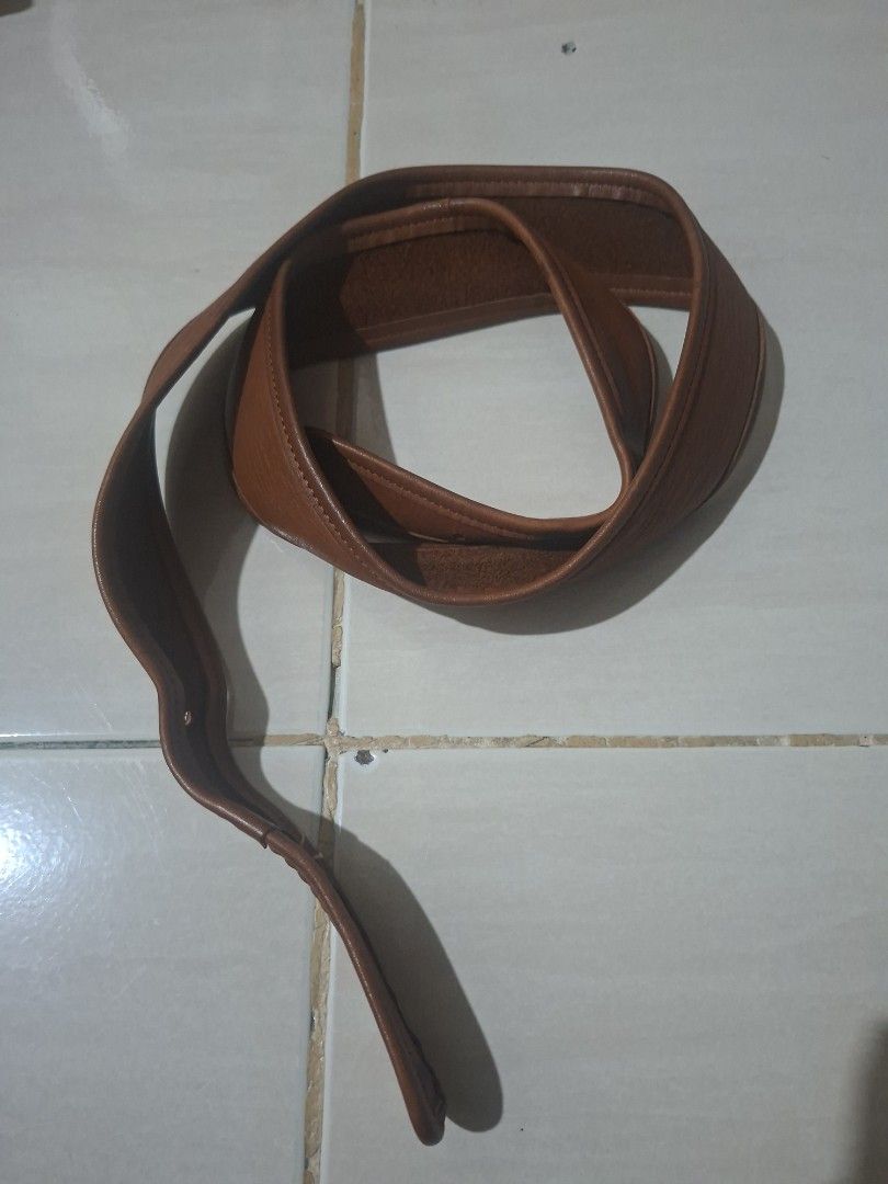Vintage Coach Musette (Category: Luxury Bags & Wallets) located in Cabanatuan. Submitted by thriftytrix (Listing ID 1467259170, Image 2). Description: - Material: Premium deep brown/tan leather with clean edge stitching - Closure: Dual front flaps with secure turn-lock - Hardware: Durable brass accents on the top carry handle - Structure: Holds its shape well with reinforced side panels - Style: Professional briefcase, perfect for work or daily c