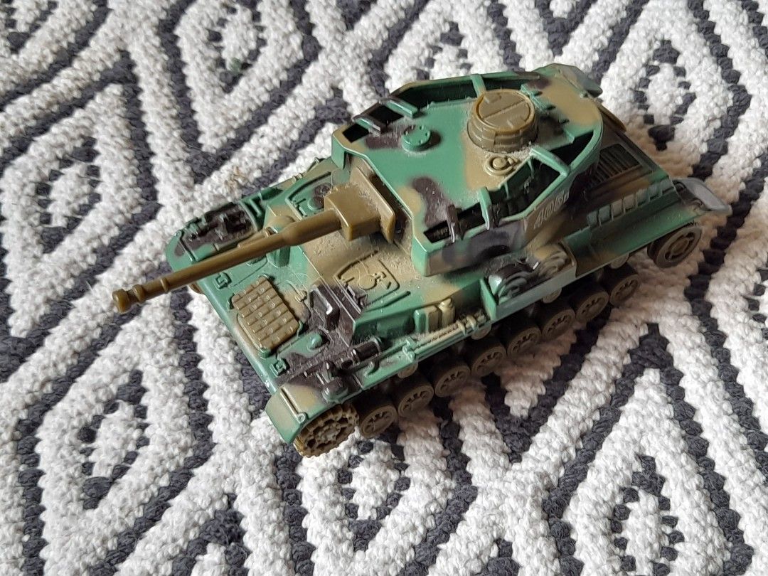 Vintage Die-cast Pull Back Army Tank (Category: Vehicle & Diecast Models) located in Bocaue. Submitted by marajapansurplus (Listing ID 1467192147, Image 2). Description: - Model: 405B army diecast toy tank - Color: Green and brown camouflage - Features: Detailed turret, long barrel cannon, and textured tracks - Selling as it is - Condition: Ready for play or display.