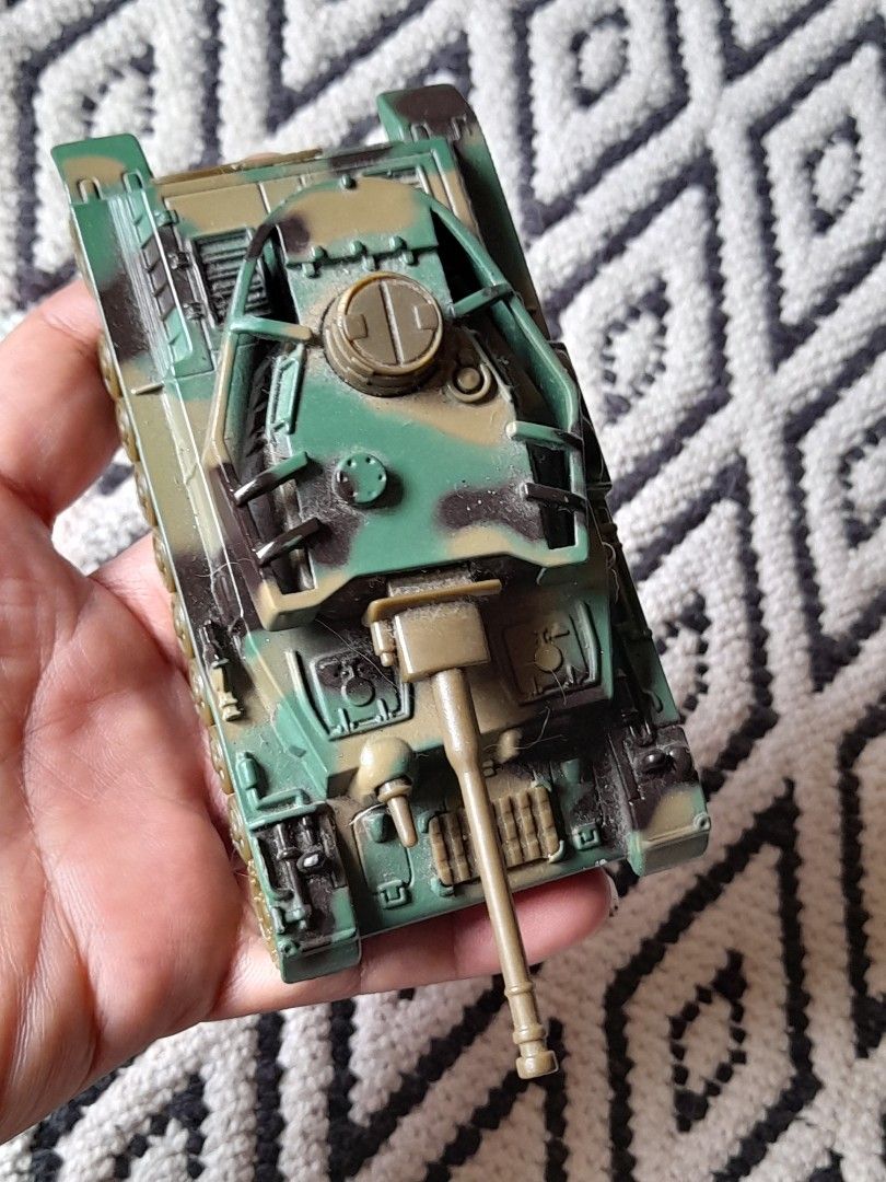 Vintage Die-cast Pull Back Army Tank (Category: Vehicle & Diecast Models) located in Bocaue. Submitted by marajapansurplus (Listing ID 1467192147, Image 3). Description: - Model: 405B army diecast toy tank - Color: Green and brown camouflage - Features: Detailed turret, long barrel cannon, and textured tracks - Selling as it is - Condition: Ready for play or display.