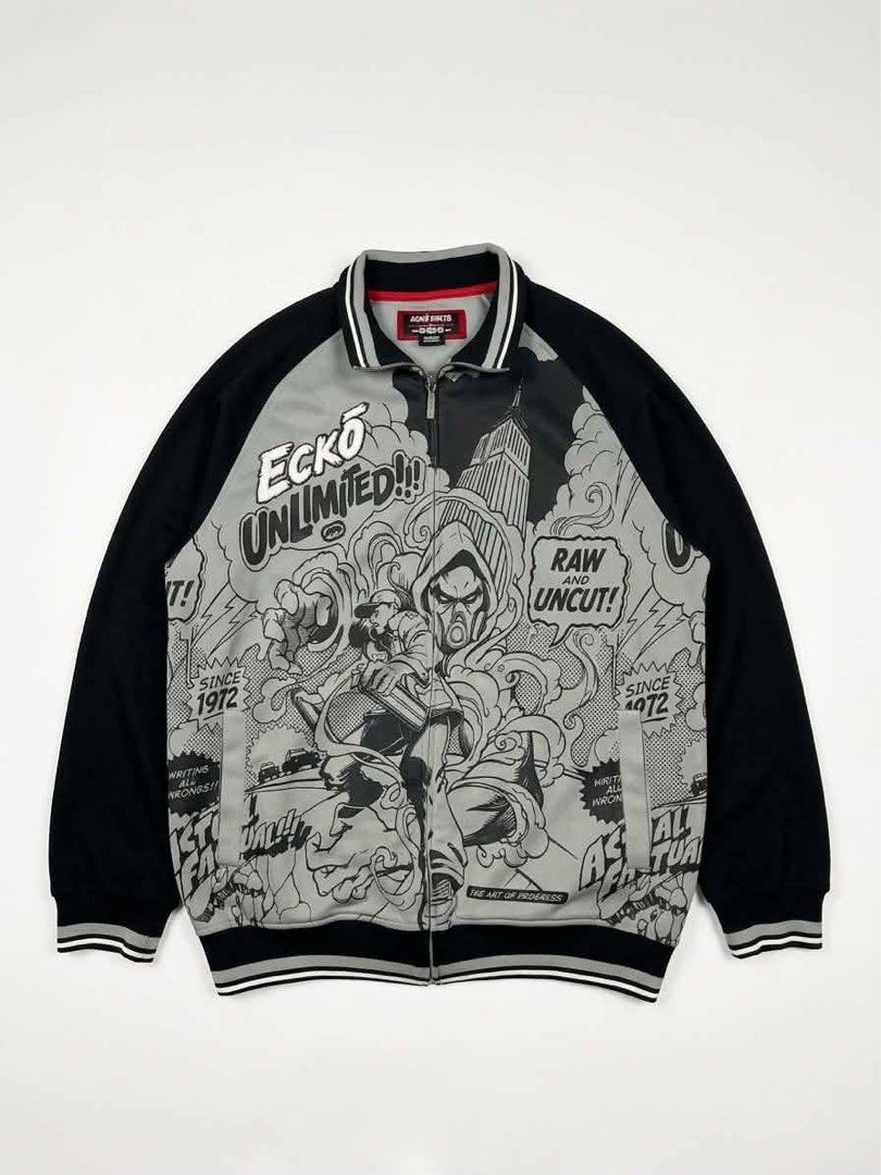 VINTAGE ECKO TRACK JACKET (Category: Coats, Jackets and Outerwear) located in Manila. Submitted by randomloots2 (Listing ID 1467291085, Image 1). Description: - Brand: Marc Ecko - Size: Medium - Color: Black, grey, and white - Design: Bold comic book graphic print with 'Ecko Unlimited!!!' embroidery - Details: Full front zipper with branded metal pull, striped ribbed collar, cuffs, and hem - Condition: Inner neck label and care instructions attac