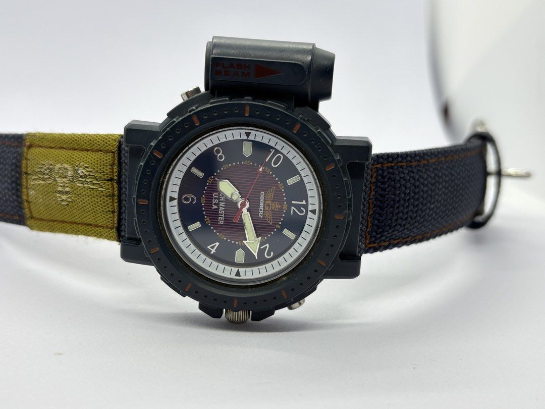Vintage Field Watch with Flash Beam (Category: Men's Watches) located in Quezon City. Submitted by rentoti (Listing ID 1467286177, Image 2). Description: Up for sale is a rare, vintage Gooberz “Watch Master U.S.A.” quartz field watch in fantastic, fully working condition. This rugged timepiece features a unique built-in side flashlight (flash beam module) mounted on the left side of the case. Perfect for collectors of retro outdoor gear, or anyon