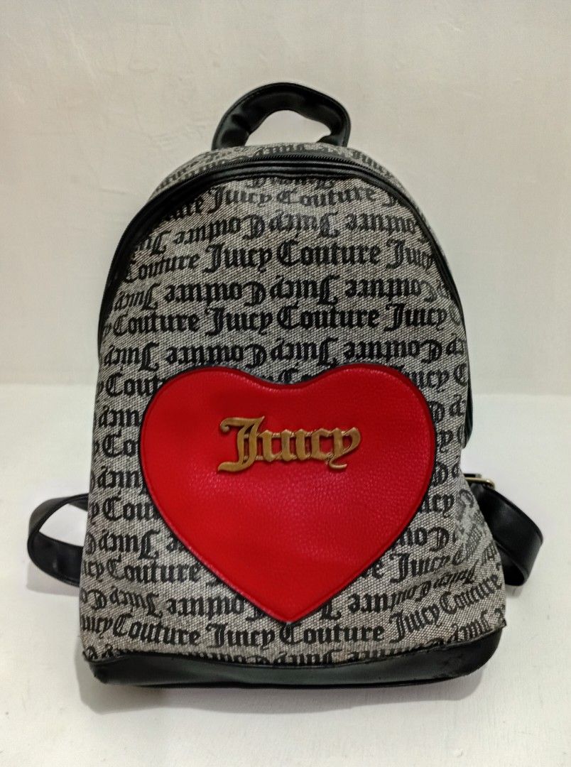 Vintage JUICY COU TURE Monogram w/ ❤️Backpack (Category: Backpacks) located in Navotas City. Submitted by riyuwi (Listing ID 1467231848, Image 2). Description: PreOWNED LIGHTLY USED WellUsed Authentic Vintage Juicy Couture Monogram Canvas & Leather wth Heart applique backpack - Iconic black logo print with red heart patch and gold lettering - Black trim, top handle, and adjustable shoulder straps - Secure main zipper closure with matching monogra