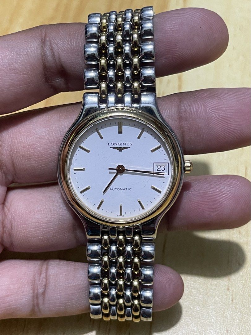 Vintage Longines La Grande (Category: Men's Watches) located in Taguig. Submitted by tester1x (Listing ID 1467279290, Image 2). Description: Vintage Longines La Grande Swiss Made L5 634 3 26577880 Automatic White Dial Sapphire Crystal Gold Plated Bezel Two Tone Stainless Steel Case & Bracelet 34mm 7inch wrist size .