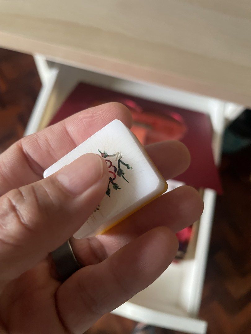 Vintage Mahjong Set with dice and Chips (Category: Board Games & Puzzles) located in Cebu City. Submitted by modelrunway (Listing ID 1466989156, Image 3). Description: - Complete mahjong set featuring traditional white tiles with classic Chinese character, circle, and bamboo carvings - Housed in a stunning decorated gold box branded with RAPTURE on the side - Includes a shiny gold interior, red ribbon handle, and multicolored gaming chips - Perfe