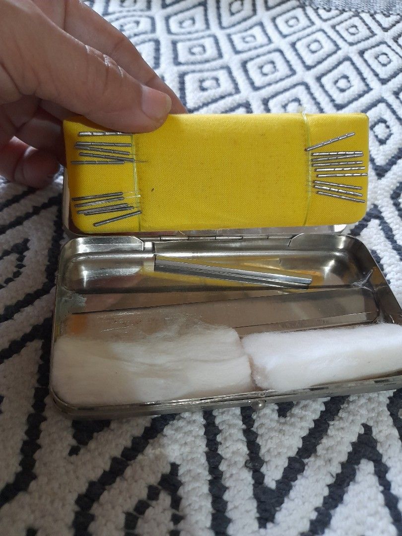 Vintage Metal Case with Acupuncture Needles Set (Category: Medical Supplies & Tools) located in Bocaue. Submitted by marajapansurplus (Listing ID 1467337726, Image 1). Description: - Vintage metal storage case for traditional acupuncture needles - Secure, compact tin container with protective closure - Needles neatly arranged on bright yellow fabric cushions - Cotton padding built inside the case lid for extra protection - Ideal piece for collect