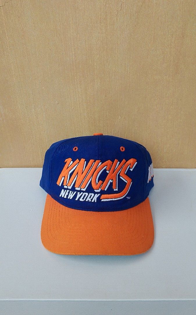 Vintage New York Knicks Hat (Category: Caps & Hats) located in Lipa City. Submitted by meechytwotwotwo (Listing ID 1467194697, Image 2). Description: • Vtg New York Knicks Hat - One Size Fits All - Dada Snap - Hairline / 2 missing male button Plss check photos for actual condition additional shipping fee MODE OF PAYMENT: GCASH/NO COD payment first before shipment Thank you..