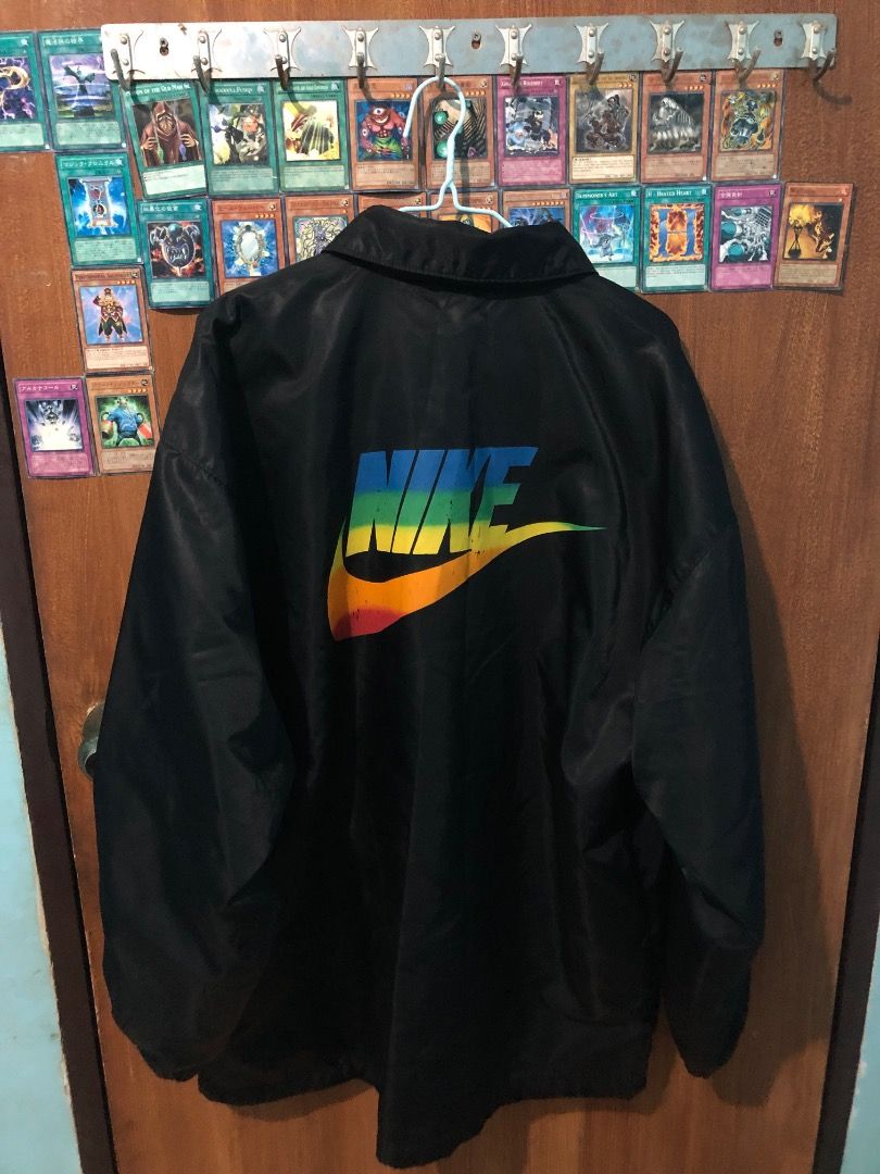 Vintage Nike Rainbow Logo Black Coach Jacket (Category: Coats, Jackets and Outerwear) located in San Fernando. Submitted by unclebob00 (Listing ID 1467321998, Image 3). Description: Vintage Rare Nike rainbow(Coach Jacket) minimal chip crack on back logo 26x32.
