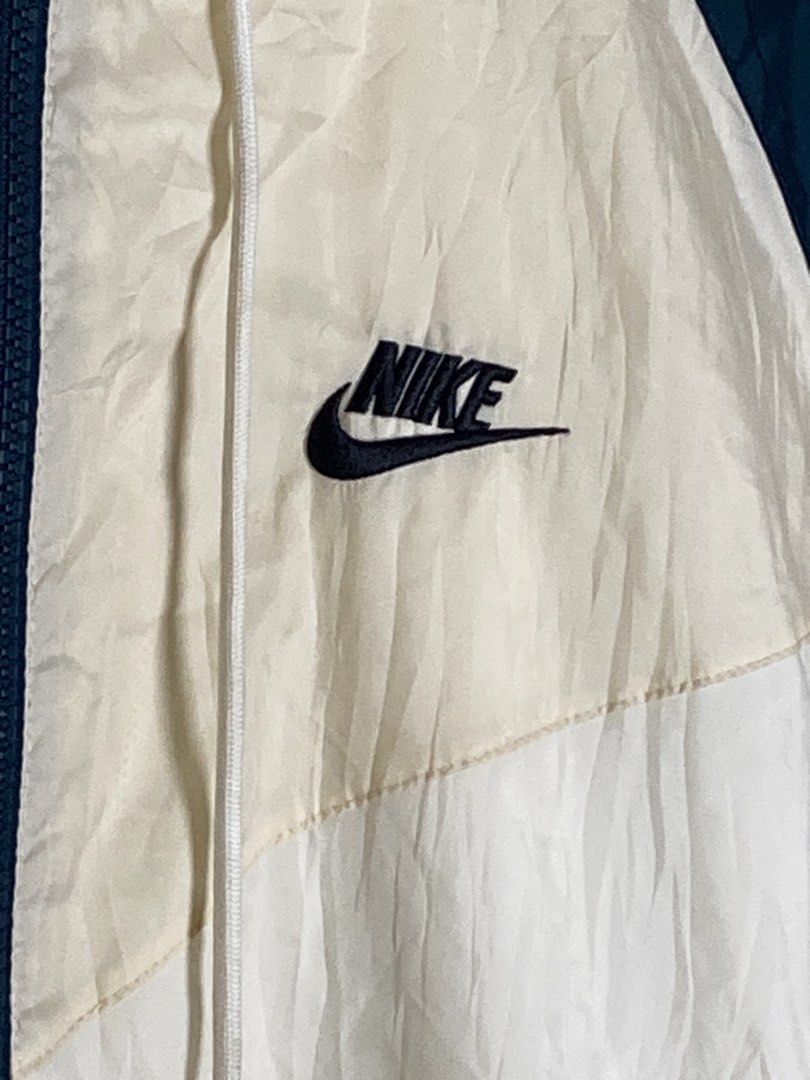 Vintage Nike Windrunner Jacket Cream Teal Blue (Category: Coats, Jackets and Outerwear) located in Baguio. Submitted by drip_n_drop (Listing ID 1467325457, Image 3). Description: - Vintage Nike colorblock windrunner jacket (cream, off-white, and dark teal blue) - Full zip front with high collar and adjustable drawstrings - Embroidered black Nike logo on the chest and large swoosh on the back - Two secure zippered hand pockets - Comfortable ribbed