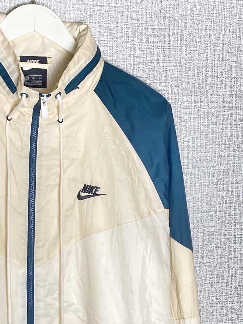 Vintage Nike Windrunner Jacket Cream Teal Blue (Category: Coats, Jackets and Outerwear) located in Baguio. Submitted by drip_n_drop (Listing ID 1467325457, Image 2). Description: - Vintage Nike colorblock windrunner jacket (cream, off-white, and dark teal blue) - Full zip front with high collar and adjustable drawstrings - Embroidered black Nike logo on the chest and large swoosh on the back - Two secure zippered hand pockets - Comfortable ribbed