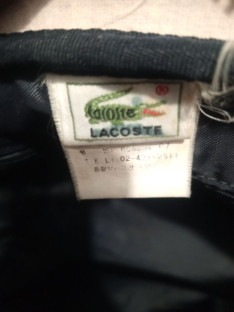 Vintage Red Lacoste Shoulder Bag (Category: Shoulder Bags) located in Caloocan City. Submitted by goldendragon_b05555 (Listing ID 1467362378, Image 3). Description: - Brand: Lacoste - Color: Classic Red - Style: Shoulder bag with debossed oval logo on the front - Straps: Dual red shoulder straps - Closure: Secure top zipper closure - Interior: Dark fabric lining with internal brand tag - Condition & Size: Sturdy construction, ideal everyday size 