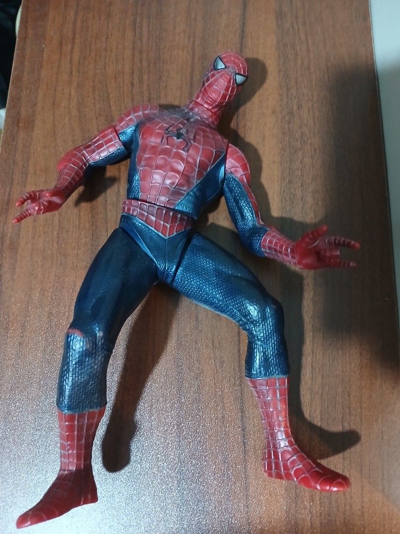 Vintage Spider-Man Action Figure Toy (Category: Figurines & Statues) located in Quezon City. Submitted by mapanak24 (Listing ID 1467252937, Image 3). Description: - Articulated Spider-Man action figure - Textured red and blue suit with classic web pattern - Classic web-shooting hand gestures on both hands - Features a large black back spider emblem and a smaller chest logo - Fully articulated joints at the arms, legs, and torso - Condition note: 