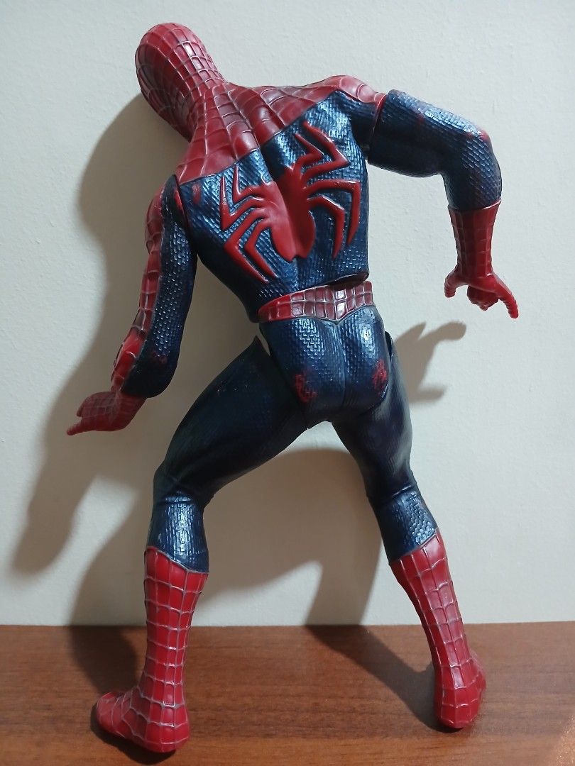 Vintage Spider-Man Action Figure Toy (Category: Figurines & Statues) located in Quezon City. Submitted by mapanak24 (Listing ID 1467252937, Image 2). Description: - Articulated Spider-Man action figure - Textured red and blue suit with classic web pattern - Classic web-shooting hand gestures on both hands - Features a large black back spider emblem and a smaller chest logo - Fully articulated joints at the arms, legs, and torso - Condition note: 