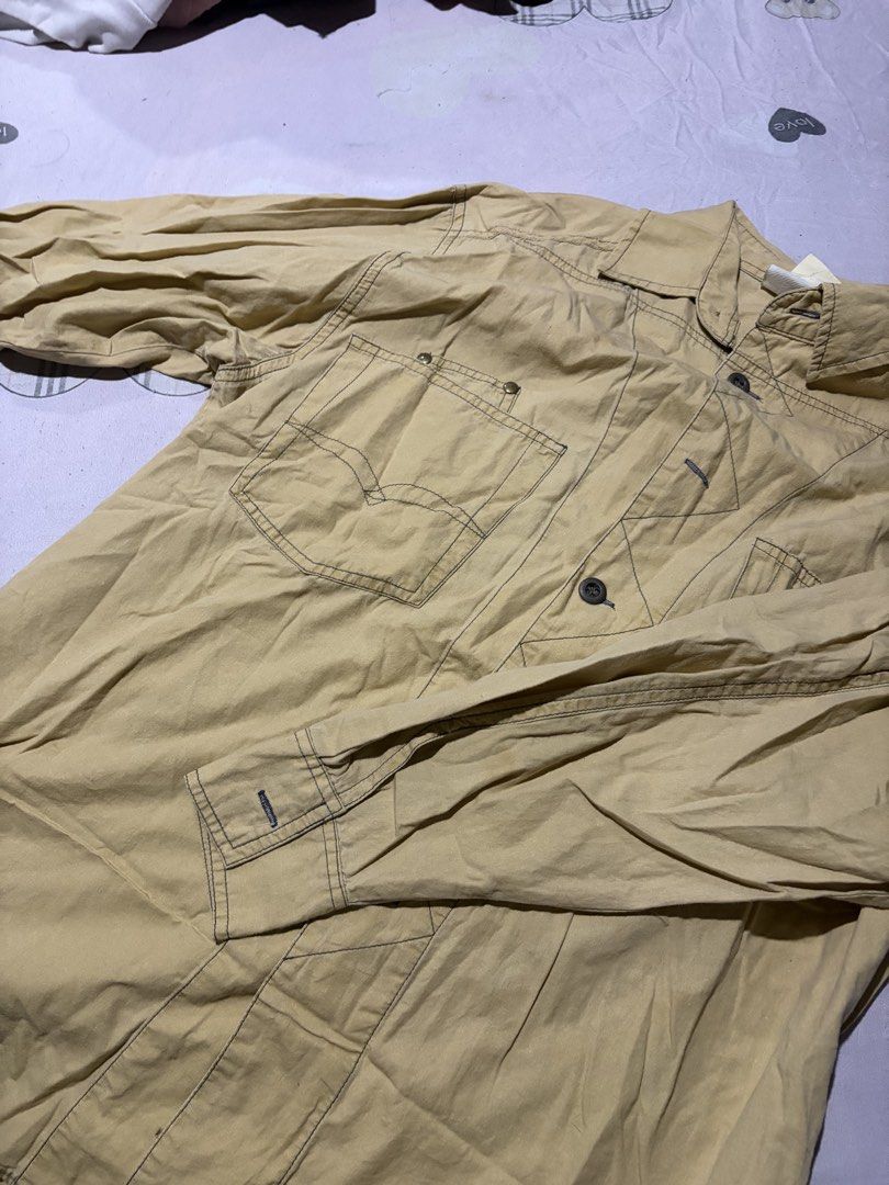 Vintage Tan Long Sleeve Button Down Shirt (Category: Tshirts & Polo Shirts ) located in Manila. Submitted by mcllts (Listing ID 1467344155, Image 2). Description: - Color: Classic tan - Style: Utility/button-down shirt - Details: Contrasting dark stitching all over - Pockets: Two chest pockets with button flaps - Cuffs & Collar: Button cuffs and structured collar - Closure: Front button closure NOTE: You can buy 2 other items and get 5% discounts