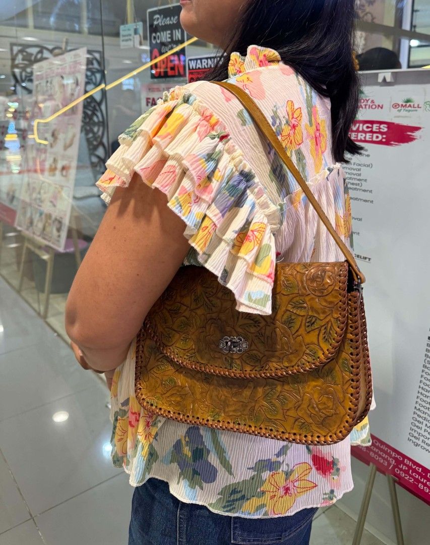 Vintage Tooled Leather Rose Floral Pattern Shoulder Bag (Category: Shoulder Bags) located in Davao. Submitted by wengbagstuff (Listing ID 1467347857, Image 2). Description: 🍀 tooled crafted leather bag 🍀 no damage, in very good condition 🍀 rare tooled kili bag 🍀 silver twisted lock.