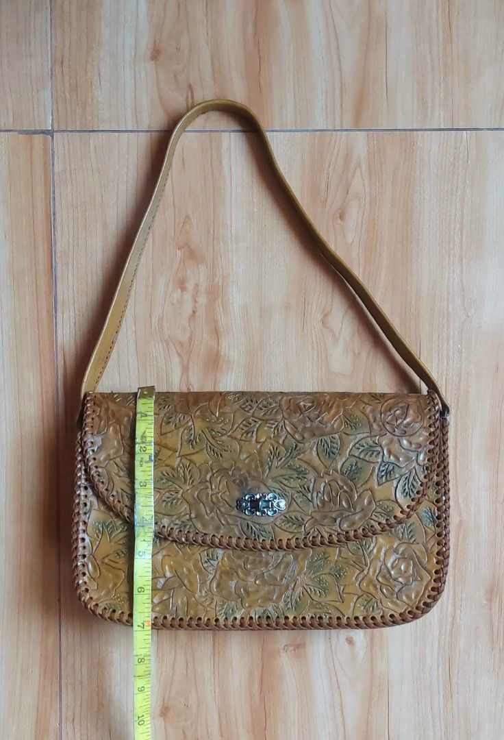 Vintage Tooled Leather Rose Floral Pattern Shoulder Bag (Category: Shoulder Bags) located in Davao. Submitted by wengbagstuff (Listing ID 1467347857, Image 3). Description: 🍀 tooled crafted leather bag 🍀 no damage, in very good condition 🍀 rare tooled kili bag 🍀 silver twisted lock.